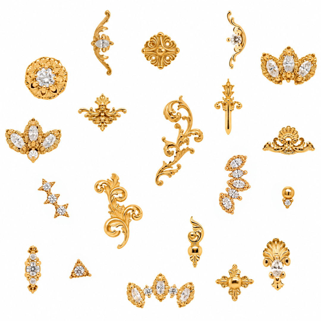 AuAdore 14k yellow-gold threadless ends collection flat lay featuring filigree and diamond-set body jewelry on white.