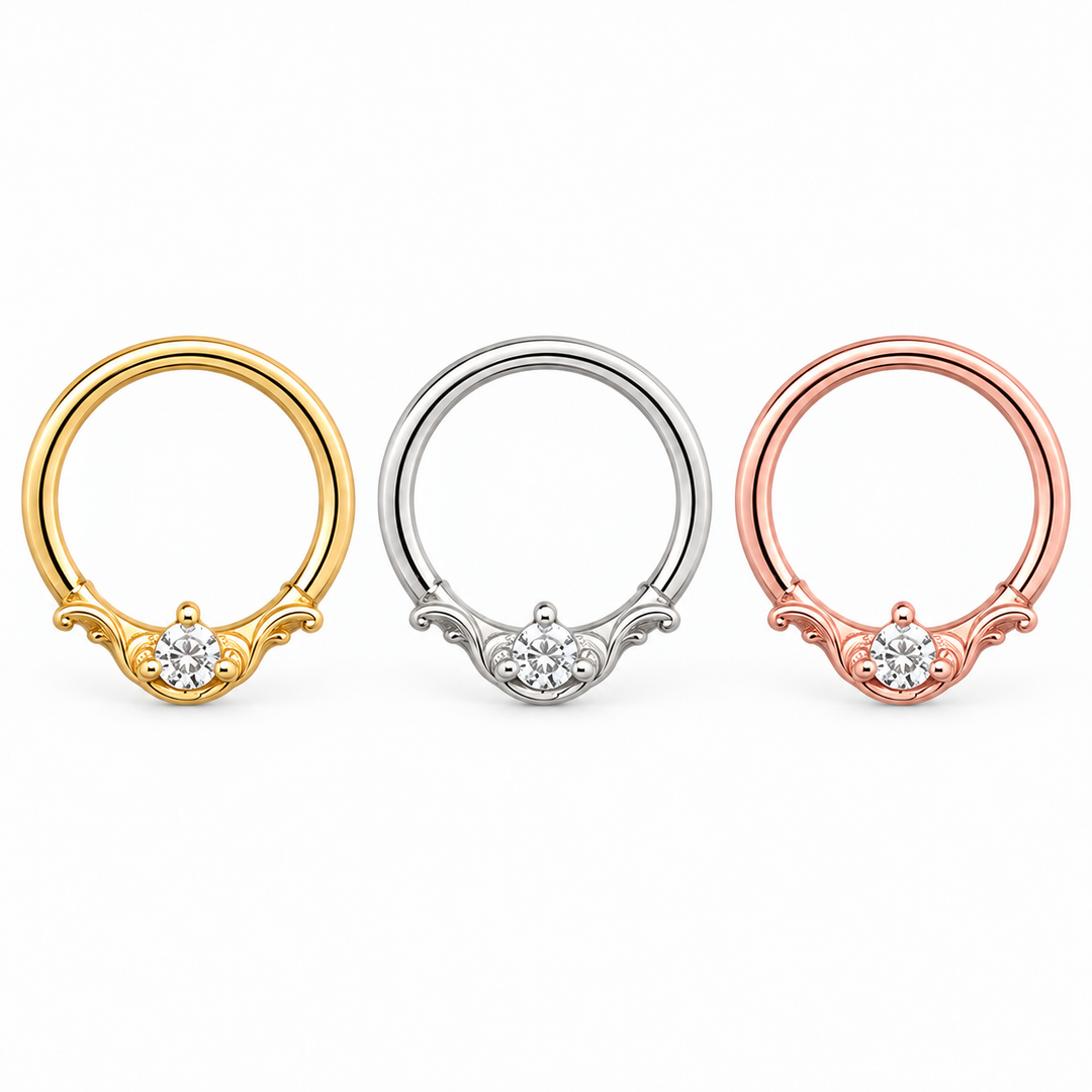 AuAdore Bishop CZ rings in yellow gold, white gold, and rose gold from left to right, with clear round stones and prongs matching each metal.