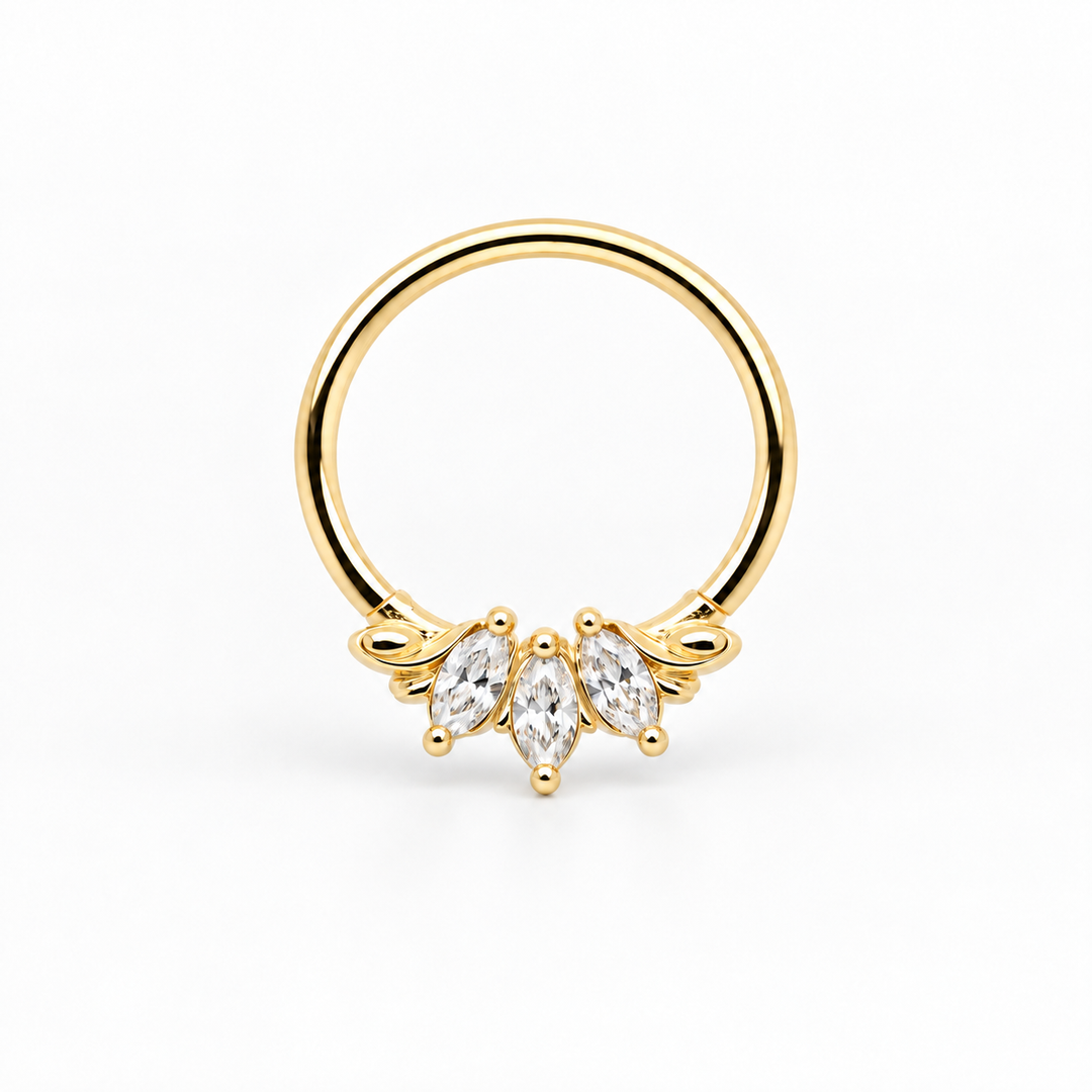 AuAdore Grandeur Lab Diamond ring in 14k yellow gold, with three clear marquise gemstones, delicate side flourishes and a smooth hoop top on white.