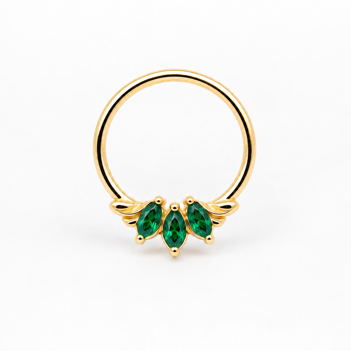 AuAdore Grandeur Lab Emerald ring in 14k yellow gold, with three green marquise gemstones, delicate side flourishes and a smooth hoop top on white.