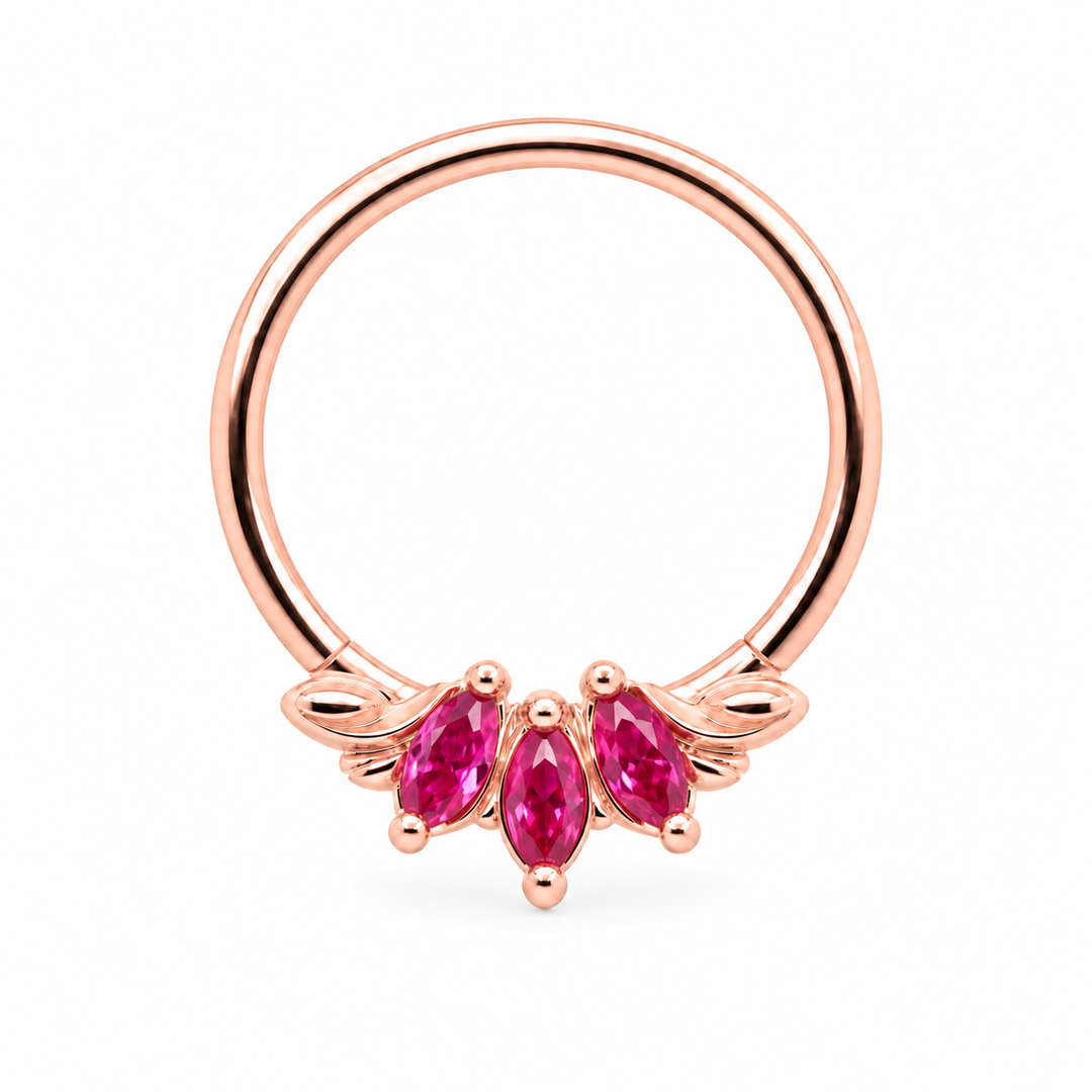 AuAdore Grandeur Lab Pink Sapphire ring in 14k rose gold, with three pink marquise gemstones, matching rose-gold prongs and side flourishes and a smooth hoop top on white.