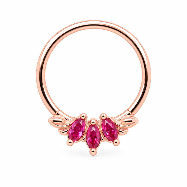 AuAdore Grandeur Lab Pink Sapphire ring in 14k rose gold, with three pink marquise gemstones, matching rose-gold prongs and side flourishes and a smooth hoop top on white.