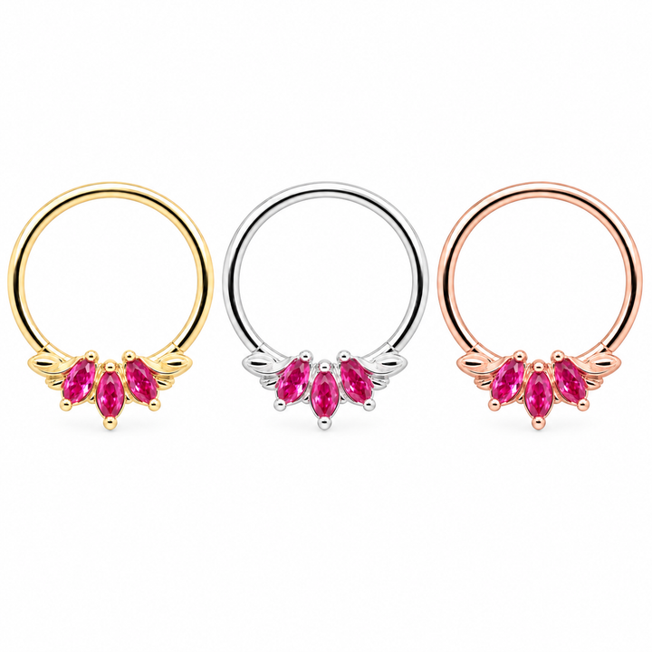 AuAdore Grandeur Lab Pink Sapphire rings in yellow gold, white gold and rose gold from left to right, each with three pink marquise gemstones and a smooth hoop top on white.
