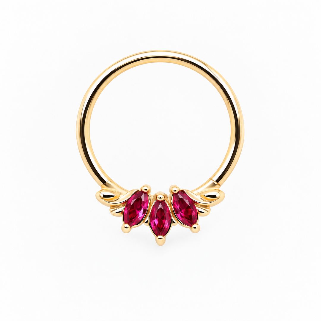 AuAdore Grandeur Lab Ruby ring in 14k yellow gold, with three red marquise gemstones, delicate side flourishes and a smooth hoop top on white.