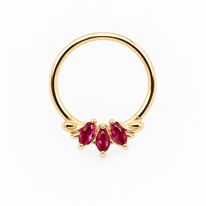 AuAdore Grandeur Lab Ruby ring in 14k yellow gold, with three red marquise gemstones, delicate side flourishes and a smooth hoop top on white.