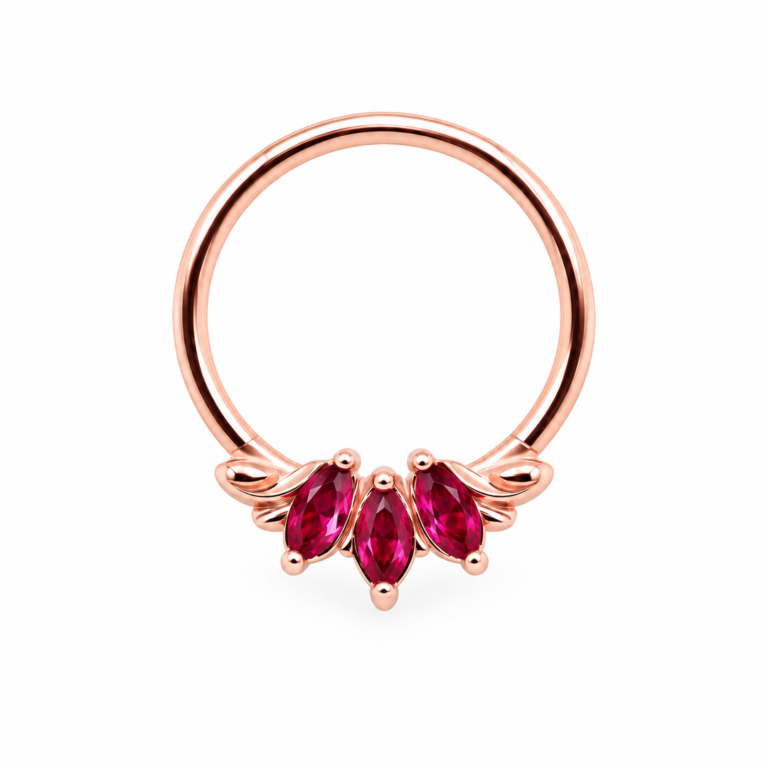 AuAdore Grandeur Lab Ruby ring in 14k rose gold, with three red marquise gemstones, matching rose-gold prongs and a smooth hoop top on white.