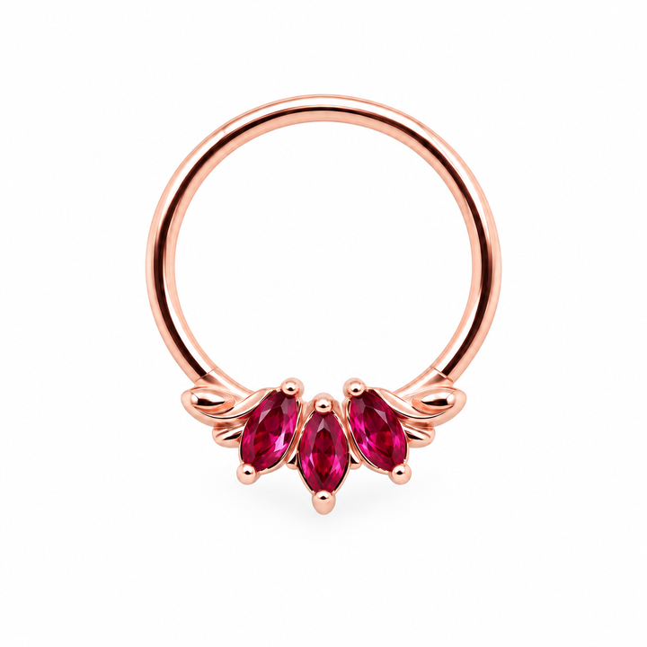 AuAdore Grandeur Lab Ruby ring in 14k rose gold, with three red marquise gemstones, matching rose-gold prongs and a smooth hoop top on white.