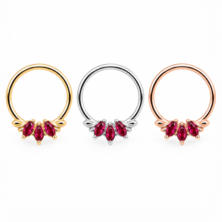 AuAdore Grandeur Lab Ruby rings in yellow gold, white gold and rose gold from left to right, each with three red marquise gemstones and smooth hoop tops on white.