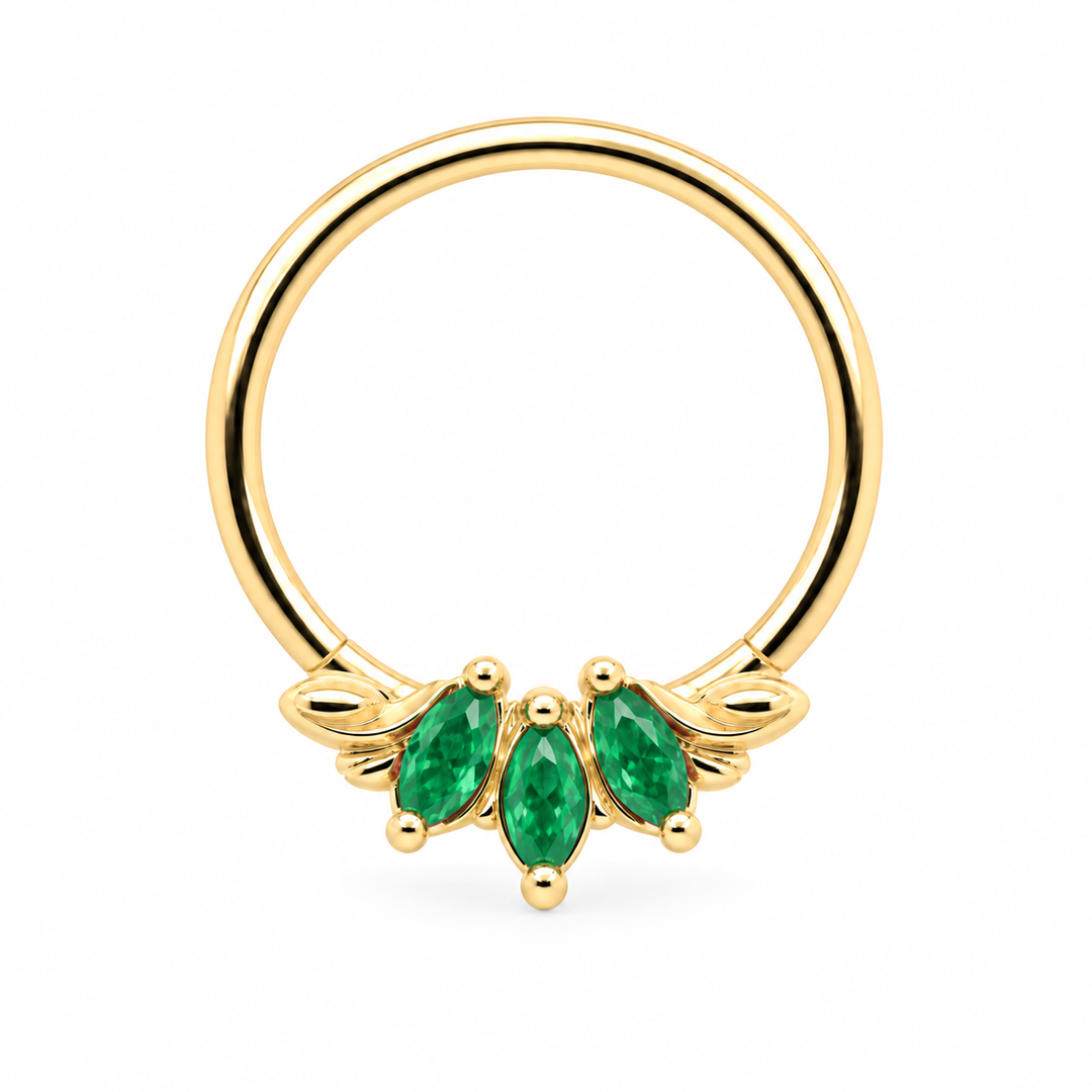 AuAdore Grandeur Natural Emerald piercing ring in 14k yellow gold with three marquise green gemstones, delicate side filigree and a smooth hoop top on white.