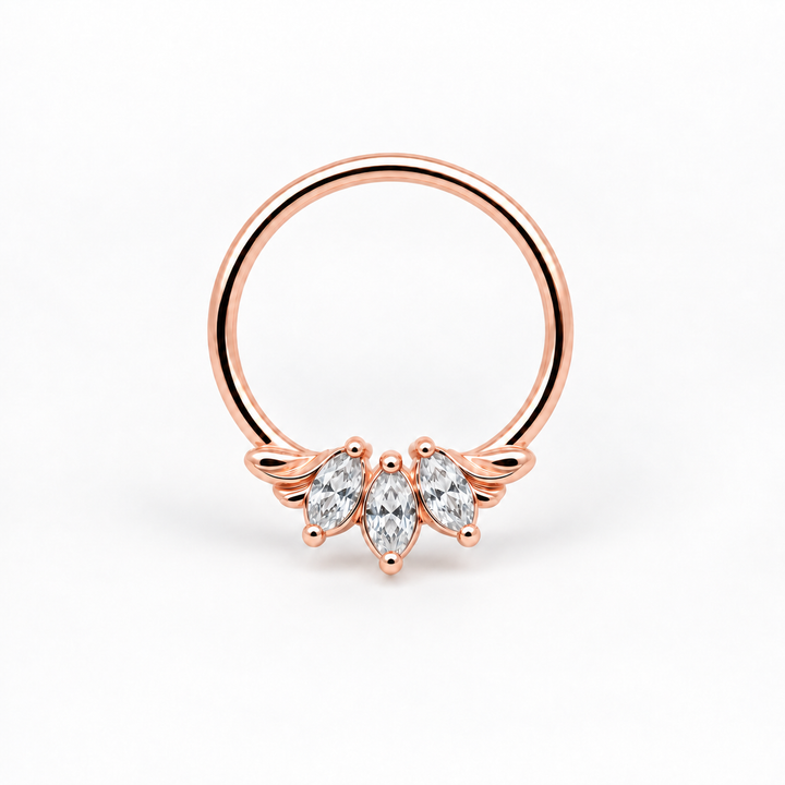 AuAdore Grandeur White Diamond 16g piercing ring in 14k rose gold with three clear marquise gemstones and matching rose-gold prongs and filigree on white. Digital product illustration.