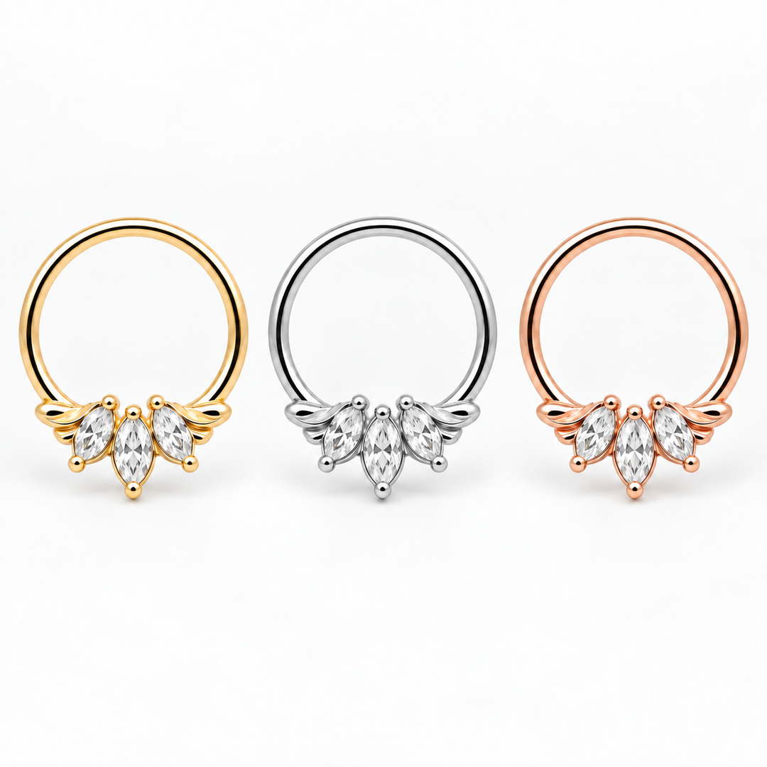 AuAdore Grandeur White Diamond piercing rings in one horizontal row: yellow gold, white gold and rose gold from left to right, with three clear marquise gemstones per ring on white. Digital product illustration.