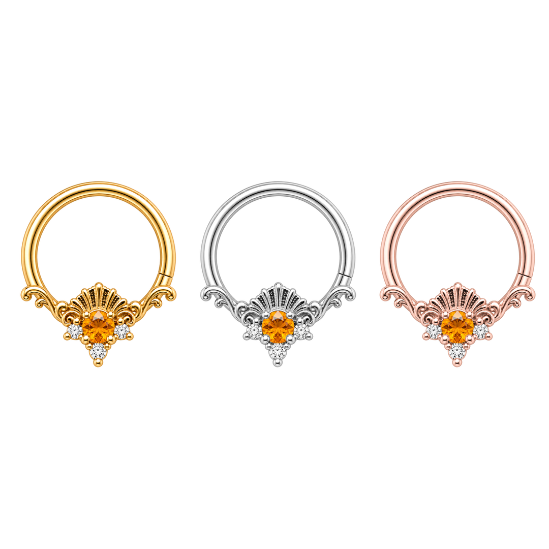 Three AuAdore Lennox Citrine and Diamond 16g rings in one horizontal row, yellow gold, white gold and rose gold from left to right. Corrected shell crest and one lower-right seam on each. Digital color illustration.